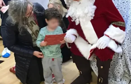 Nursery child meeting Father Christmas